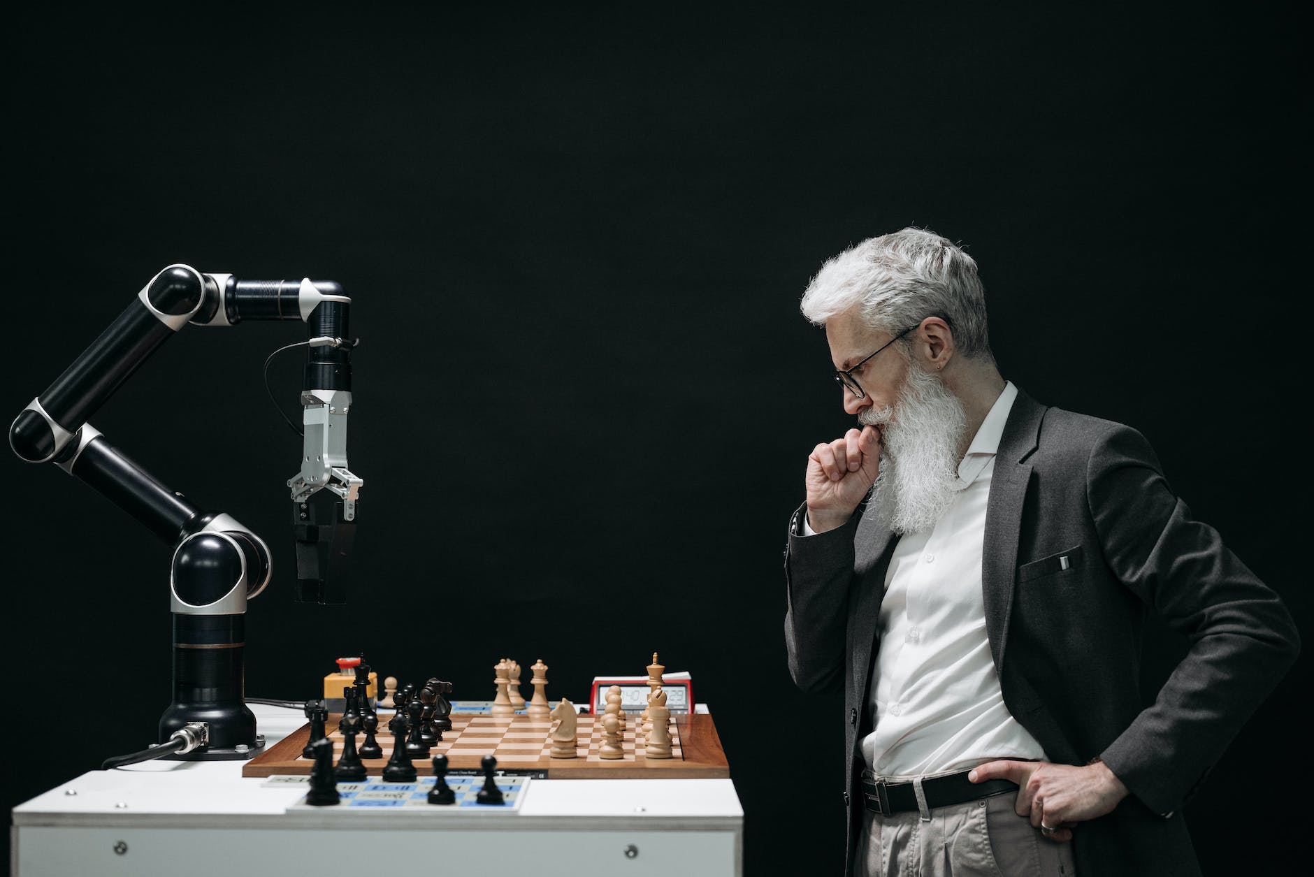elderly man thinking while looking at a chessboard , 2023 predictions