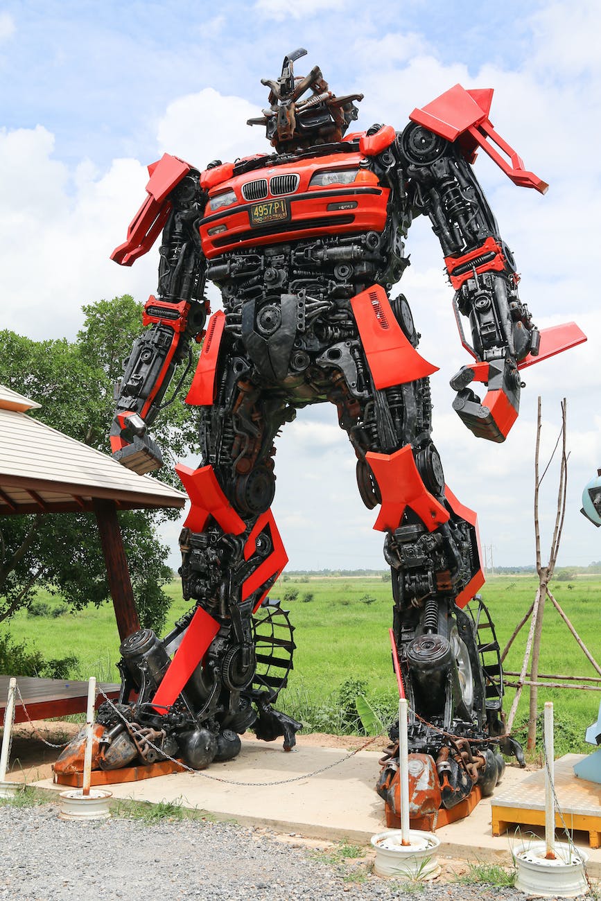 red and black robot statue artificial intelligence ai