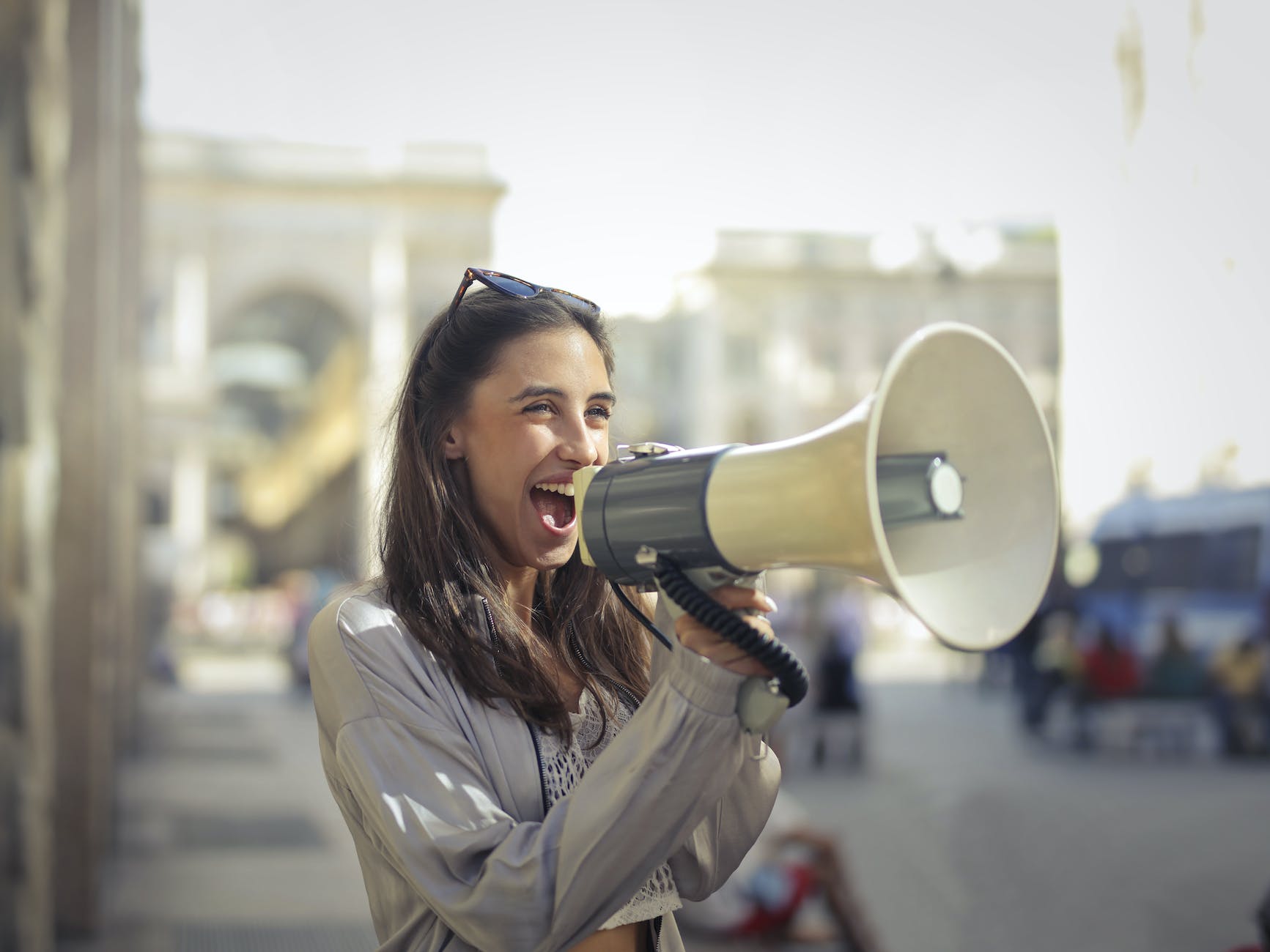cheerful young woman screaming into megaphone future of blog marketing
