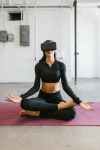 woman doing yoga while wearing virtual reality glasses trends 2023